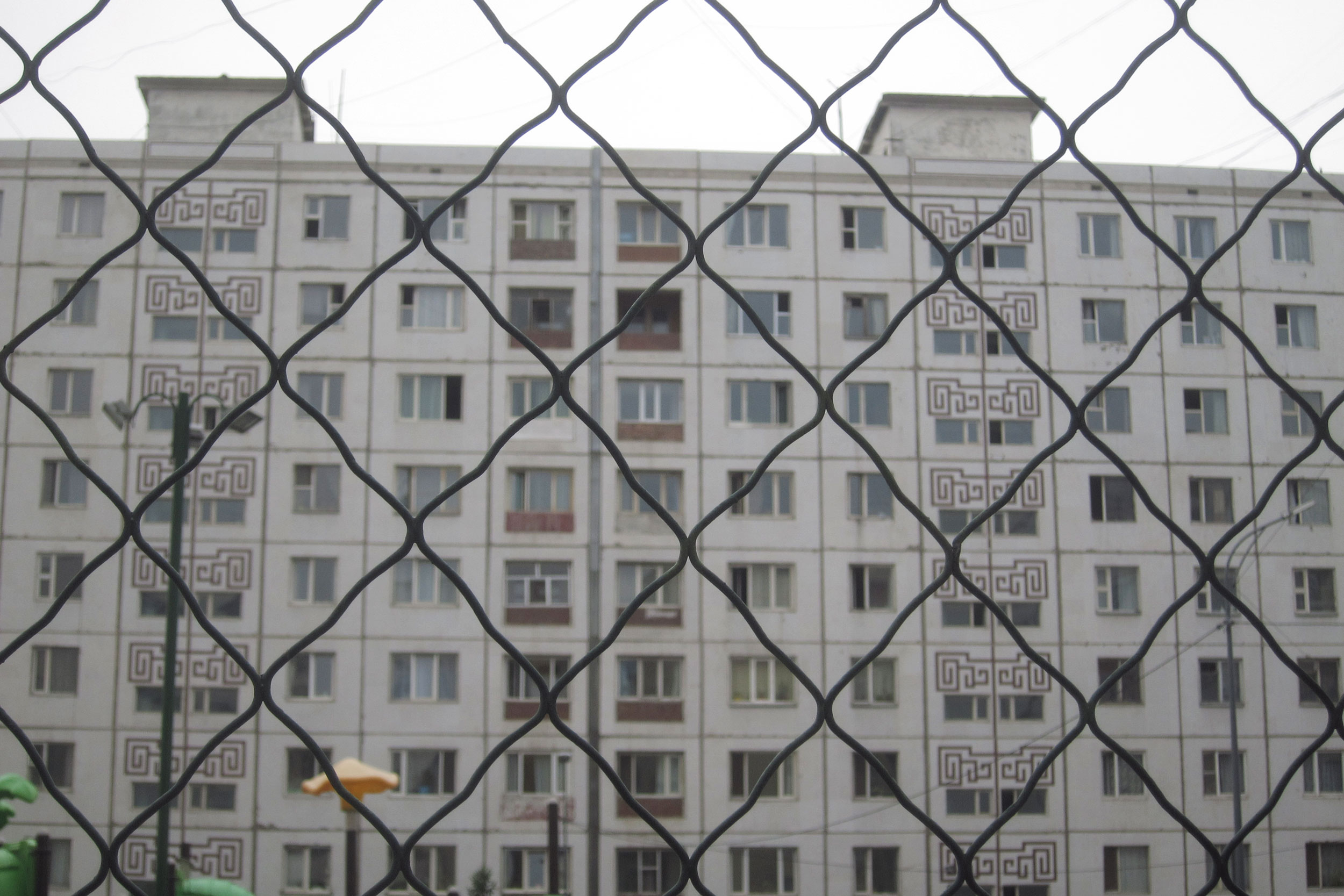 a building behind a fence