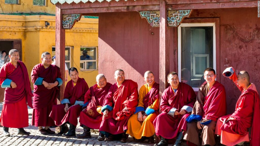 150907165306-beautiful-mongolia-22-buddhist-monks-at-gandan-monastery-super-169 monks sitting outside