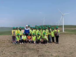team of people near wind turbines
